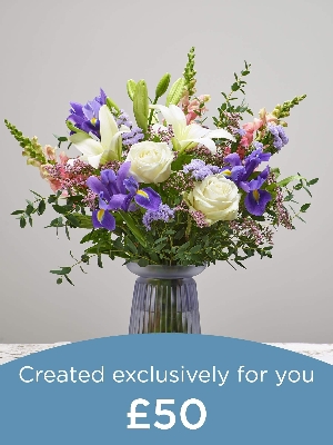 Bouquet and vase made with seasonal flowers.