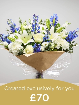 Hand tied bouquet made with seasonal flowers.